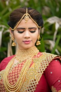 Beautiful Indian bride in embellished traditional attire during a photoshoot.